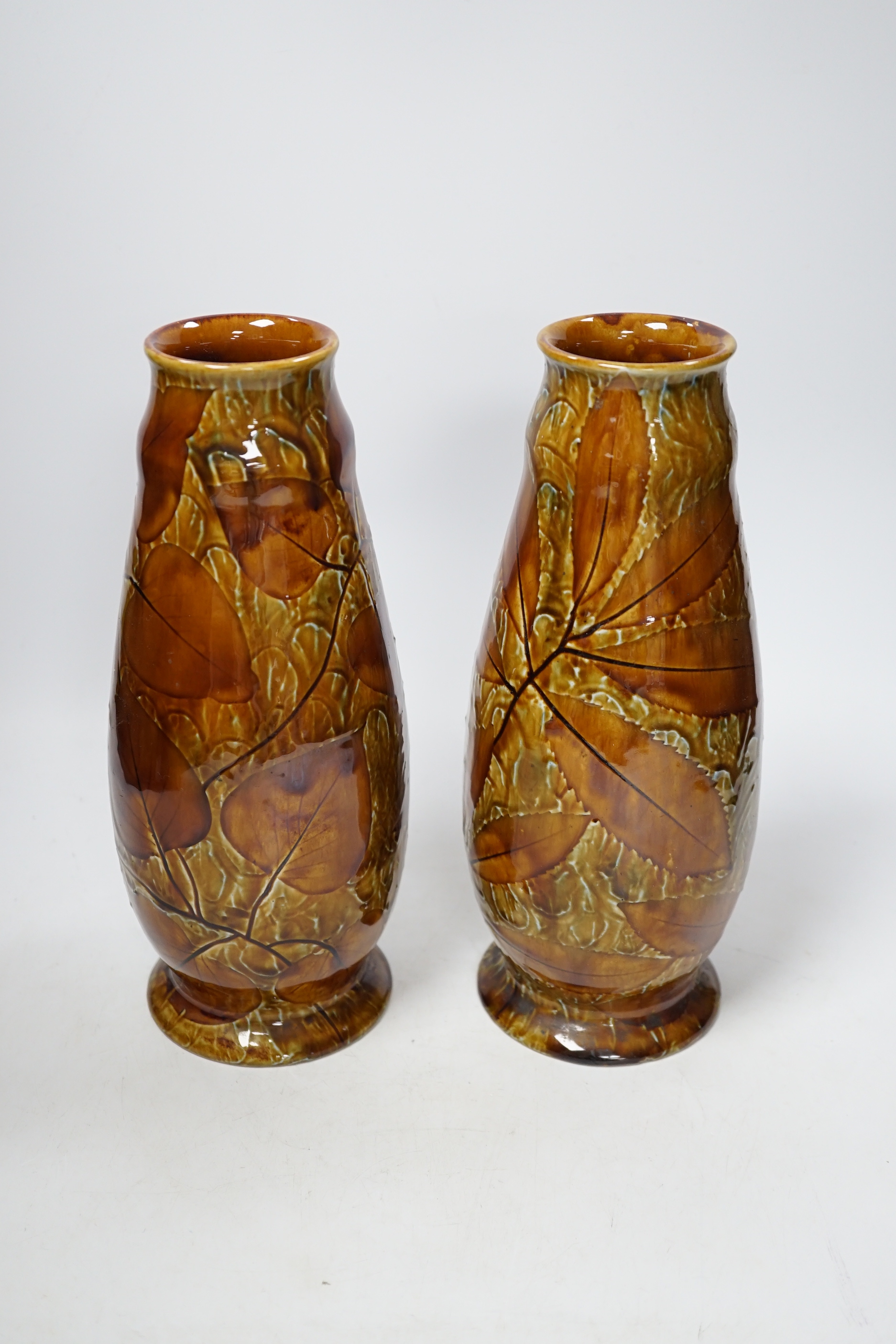 A pair of Doulton Natural Foliage ware vases, 27cm